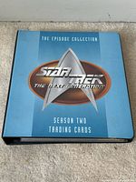 Blue album labeled Star Trek The Next Generation Season Two Trading Cards on the cover.