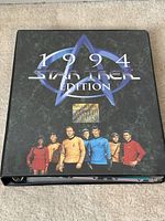 Front cover of the 1994 Star Trek trading cards album by SkyBox Master Series with Star Trek insignia and character images.