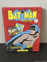 Front cover of Batman The War Years 1939-1945 hardcover book by Roy Thomas, showing vintage Batman comic artwork and title.