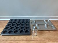 Photo of all three items together showing the muffin pan, silver divided tray and glass shaker.