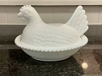 View of the milk glass hen on nest covered dish with the lid on.