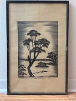 Full view of the framed African artwork print with a large tree in the foreground, islands in the background, and a canoe with a paddling figure.