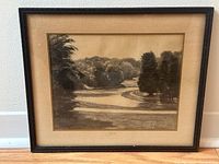 Frontal view of the entire framed charcoal drawing showing matting, frame, and artwork.