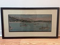 Framed vintage panoramic print of French naval ships in Villefranche Bay with black wood frame and cream matte border, showing overall condition and display.