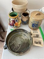 Five pottery and ceramic items including a floral vase, Barnim Pottery pieces, a mixing bowl, and a large pottery bowl with handles.