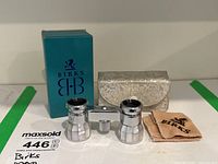 Full lot shot showing the Birks opera glasses, carrying case, cleaning cloth, and box arranged on a surface.