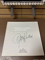 Cover of the box with title 'Weihnachtslieder auf Porzellan' and Björn Wiinblad signature