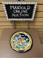 Full view of the Rosenthal collectible plate on display showing the decorative pattern and central artwork.