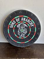 Front view of Sons of Anarchy themed dart board showing full face with logo and numbers visible