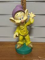 Front view of Dopey gnome figurine showing character details and size reference