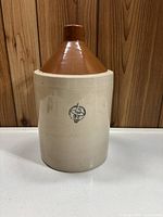 Full front view of 1 gallon stoneware jug showing two-tone glaze and overall shape.