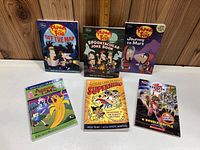 Six kids books including three Phineas and Ferb titles, Adventure Time, Calvin and Hobbes, and Bakugan comic book.