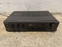 Front view of the black Technics SU-V45 stereo integrated amplifier showing the control panel with knobs and buttons.
