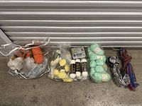 Overview of all items including bags of wool yarn and scarves