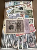 Overview image showing a variety of foreign banknotes including older German bills and others.