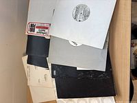 Top view of mixed vinyl singles spread showing sleeve art and labels.