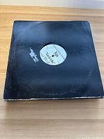 Vinyl single in black sleeve with visible label showing Nas "Nas Is Like"