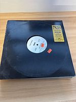 Vinyl single by Nas with black sleeve showing single details and promotional stickers