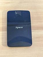 Front view of the black Apacer external hard drive showing the brand logo.