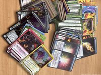 Spread of various Chaotic trading cards showing colorful characters and elements.