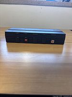 Front view of Hip Gear audio-visual system selector showing switches.