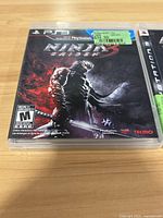 Ninja Gaiden 3 PS3 game case showing cover art of a ninja with sword, rating M, Tecmo brand.