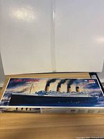 Box front of RMS Titanic 1/350 scale model kit by Minicraft with artwork of the ship.