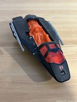 Black and orange 1986 GI Joe ARAH Cobra Night Raven Recon Drone Jet front angle with missing top hatch, showing orange cockpit and red canopy with Cobra insignia