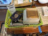 Lot contents including vintage safety razors, blades in boxes, and a green plastic tray containing these items with an auction lot card.