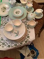 Lot overview showing both Pareek and Nestor Vellum sets on table