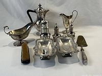 All 10 silver plate tableware items displayed together on white background