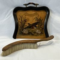 Full view of wooden crumb tray and brush set showing painting and brush detail