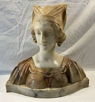 Front view of alabaster bust showing head and shoulders