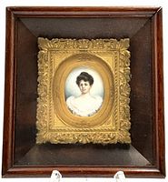 Shadow boxed framed hand painted portrait miniature of Victorian lady in ornate inner gilt frame, showing full front view.