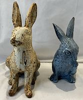 Front view of both rabbit figurines side by side