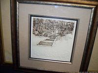 Framed print artwork showing detailed forest path scene with stairs and trees