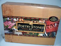 Front view of the Poetry Stones Kit box showing the product title, images of stones, and branding.
