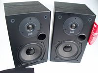 Front view of Polk T15 bookshelf speakers showing tweeter, woofer and port
