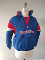 Front view of blue, red, and white Oshawa Generals Starter pullover jacket on dress form.