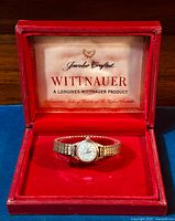 Vintage Wittnauer ladies watch in original branded red box with velvet interior.
