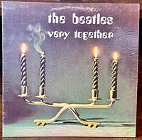 Front cover of the Beatles Very Together album LP showing four candles with one blown out and smoking.