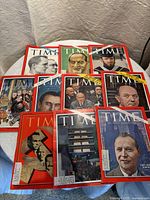 Top view of 10 vintage Time magazines with various 1960s era covers, including political and pop culture themes