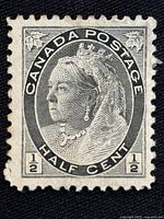 Close-up front view of the black and white 1898 Canada half-cent Queen Victoria stamp.