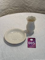 Photo showing both vase and plate together on a white tablecloth, with lot number card nearby