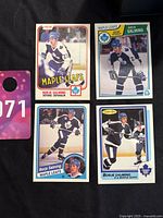 Four hockey cards featuring Borje Salming of the Toronto Maple Leafs in various action shots and poses.