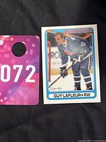 Photo showing Guy Lafleur hockey trading card from O-Pee-Chee 1990-91 series, card number 142, in good detailed condition.