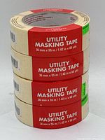 Photo of 4 rolls of utility masking tape stacked, showing size and label clearly.