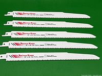 Five 9 inch Tooltech Xpert demolition sawzall blades laid out against a green background showing full blade length and teeth pattern.