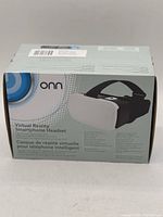 Front view of the Onn Virtual Reality Smartphone Headset box showing product image and branding