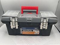 Front view of the closed Stinson 14 inch toolbox, showing brand label, red handle, and double metal latches.